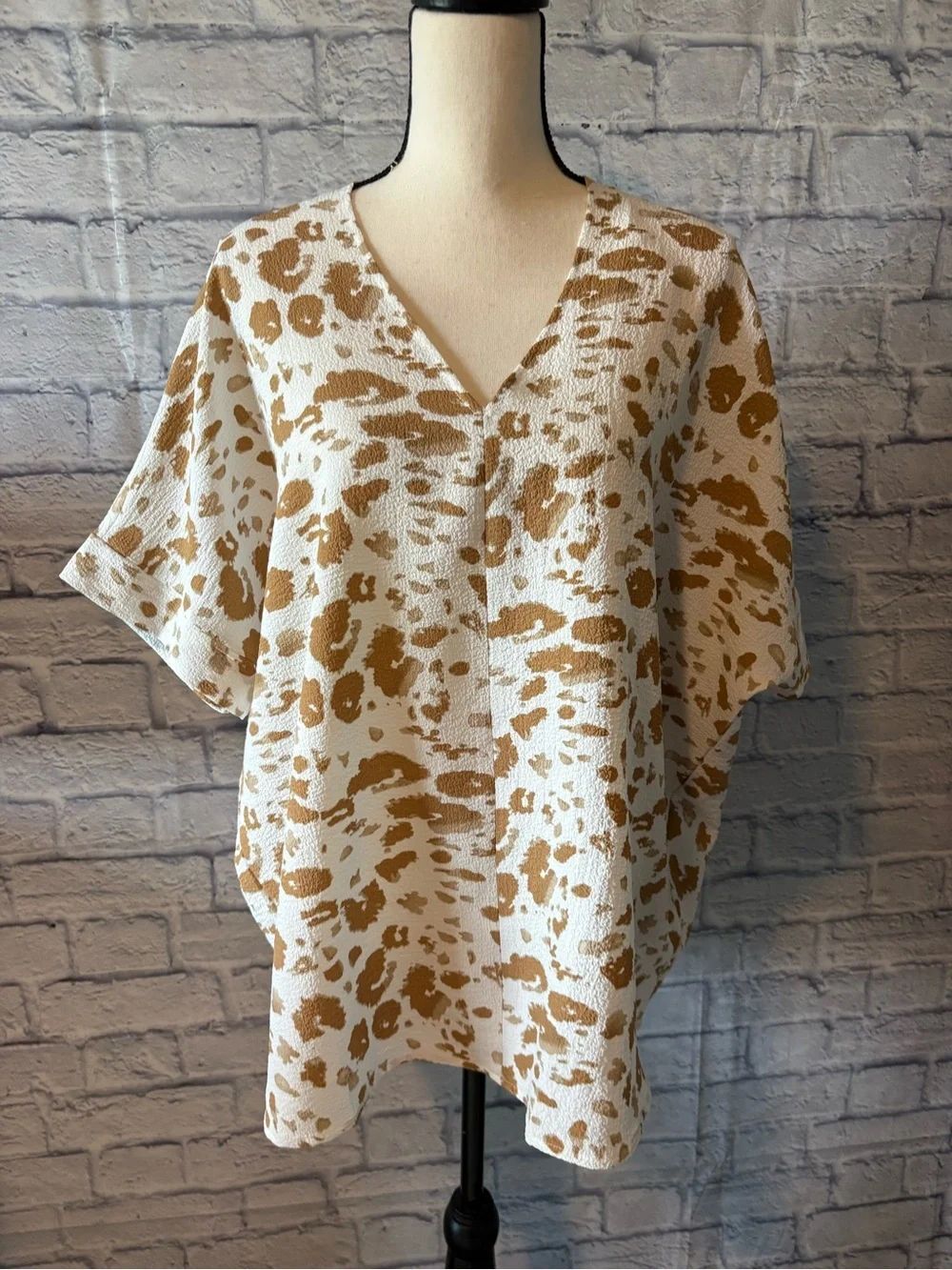 RelaxedโV-Neck Cream Tunic with Tan Abstract Print